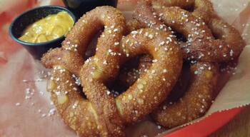 Soft, salty pretzels with sriracha mustard
and cheese sauce for dipping from Dirty Frank's Westgate location.