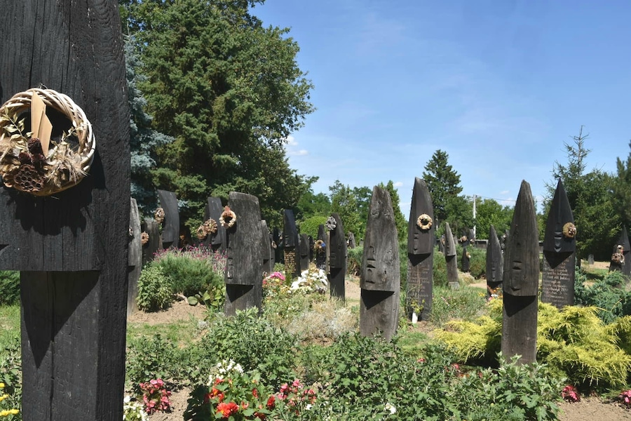 The unique cemetery of Szatmárcseke with over 600 boat-shaped wooden headstones. It's a functioning cemetery with several recent graves.