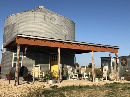 value: "Converted silo is accommodation for 4 on a llama farm in Troy TX"
