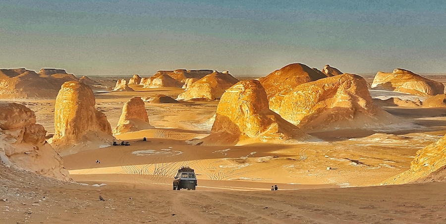 Sunset light simply paints the calcite/lime rocks golden hue from white.
The huge rocks look out of the world