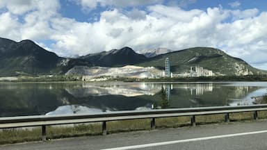 This is one of the busiest attractions in Canada’s Rocky Mountains, which is a highway pullover with a view of the country’s largest cement plant on the banks of Lac des Arcs. Just behind that, a strip mine wearing down Grotto Mountain. The EcoDome, in the middle of the photo, is 35m tall and 100m diameter, can be seen from the TransCanada Highway, houses materials used in the process of producing cement and reduces the spread of dust.

#OnTheRoad