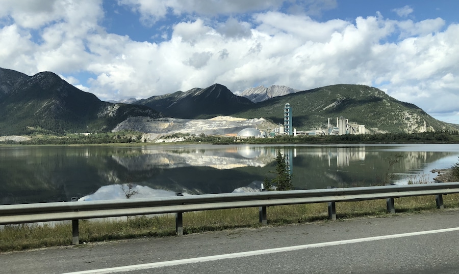 This is one of the busiest attractions in Canada’s Rocky Mountains, which is a highway pullover with a view of the country’s largest cement plant on the banks of Lac des Arcs. Just behind that, a strip mine wearing down Grotto Mountain. The EcoDome, in the middle of the photo, is 35m tall and 100m diameter, can be seen from the TransCanada Highway, houses materials used in the process of producing cement and reduces the spread of dust.
#OnTheRoad