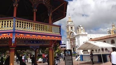 A 19th-century Mudejar kiosk sits at the center of an otherwise traditional town square. In the back, The Cathedral of the Immaculate Conception is a late 19th-century English Gothic revival church that serves as the cathedral of the Roman Catholic Diocese of Hong Kong
