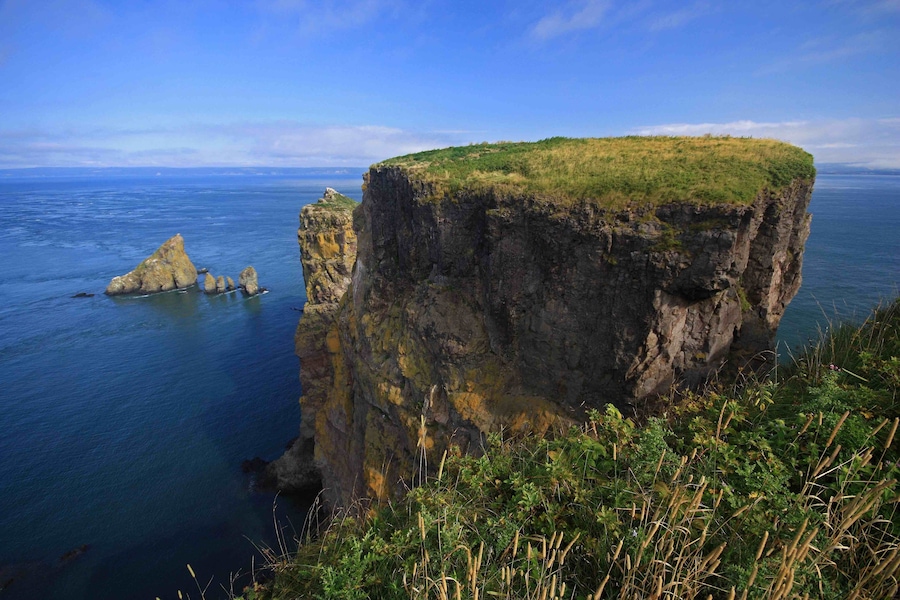 This is the view overlooking the Bay of Fundy from the tip of Cape Split, Nova Scotia. A nice 13 kilometers return hike to the end of the cape. The trail is well maintained, but watch the weather as it can be sunny at the trail head and then be foggy at the end. There are some trails down the cliffs to the coastline as well, but be very aware of the tides as many people have been stranded due to the fast tides.