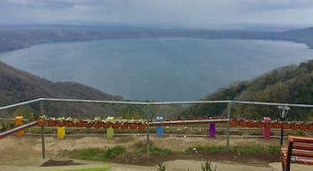 Apoyo Lagoon rests in the crater of an extinct volcano.  At the lookout point there are many shops/vendors and places to eat and a restroom