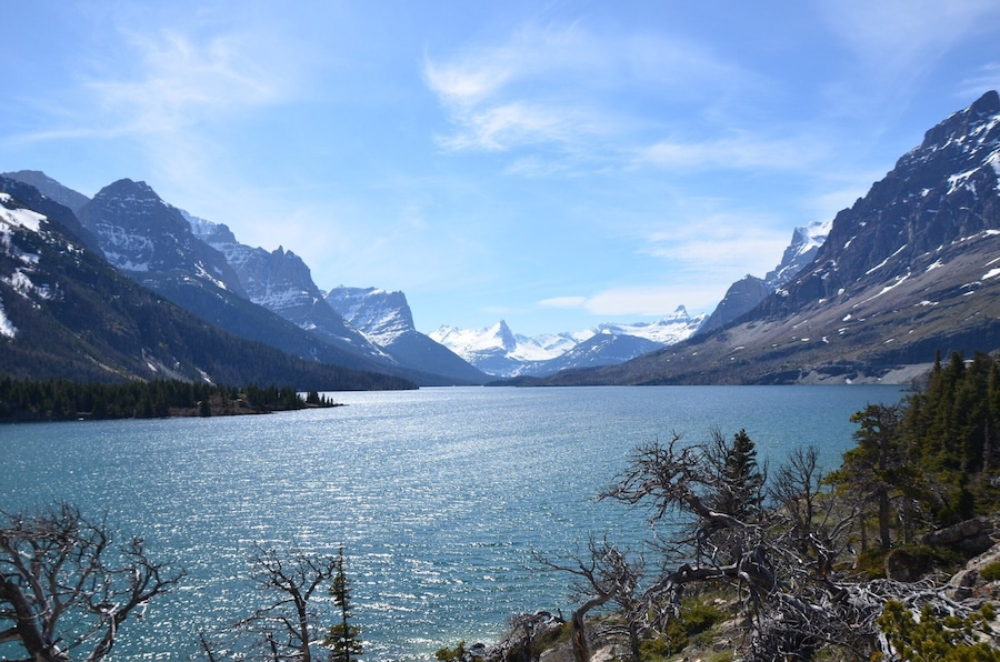 Just after the entrance to Glacier National Park there is a small path leading out on a rock formation that provides incredible views of the mountain scape across the lake. We thought we would be able to take the Going To The Sun Road through the park, but it’s opening was delayed (it was already the middle of May) due to a late thaw and portions of the road were still covered in snow. This little overlook, only a short walk past the gate, was perfect after having driven over an hour out of the way to drive through the park. #mountains #nationalparks #roadtrip