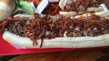 Once taken on by the Man vs Food show the original haystack is a delicious but monstrous steak sandwich with a half pound of seasoned steak, melted mozza cheese and crispy shoestring potatoes in a hoagie roll. #foodiefinds 