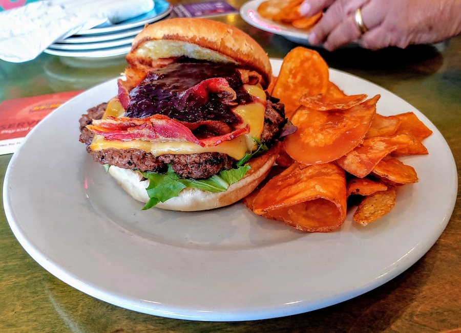 Every year, because of this specific restaurant, I anxiously await the menu release of Columbus Burger & Beer Week.
The specialty burgers at Caribbean Jerks hit all the right bites, every time.
They're thoroughly creative, well crafted, the ingredients play seamlessly together, and most importantly, for me personally, they still eat like a sandwich and don't devolve into some knife and fork catastrophe.
This year's entry is the Blackbeard’s Revenge – chipotle seasoned Burger sits on Spring Mix and is topped with Smoked Gouda, Hickory Smoked Bacon and house-made Blackberry Java Porter Jam.
#Trovember
