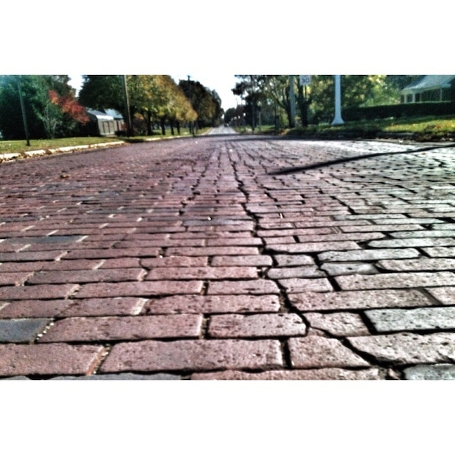 This is a rare example of a brick road still in use. Here in Michigan, and the Midwest, most brick roads have gone by the wayside due to the brutal winters and freeze/thaw cycles inherent to this part of the country.
For example, in the early 1900s, most of the streets in the city of Grand Rapids, Michigan were paved with brick. Today, there are only about 20 blocks of brick paved streets remaining (totalling less than 0.5 percent of all the streets in the city limits). -wiki
#PureMichigan #roads #roadto