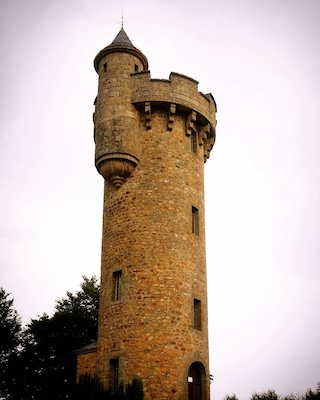 Rapunzel tower of Masseret. Cute village with the tower in the centre and a big hotel next door.