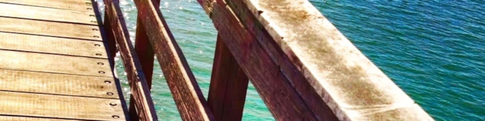 Look for the long wooden thing sticking out into the ocean.