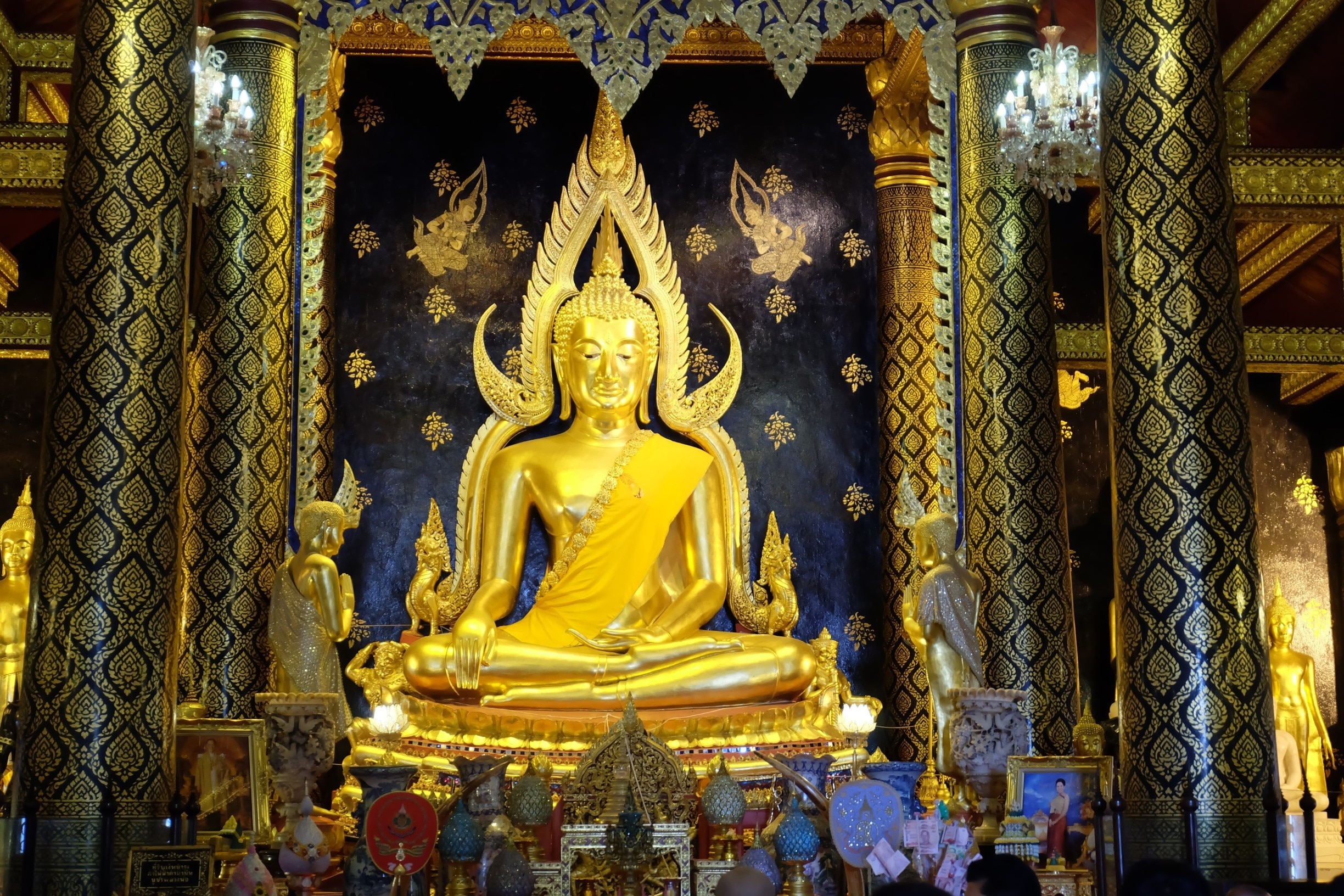 Beautiful The attitude of subduing Mara Buddha Image in Thailand . In Sukkhothai period  .The Lord has a wide elbow 5 1 5 creep natak inches (2.875 m) high seven cubit (3.5 meters) with cast polished bronze Buddha.