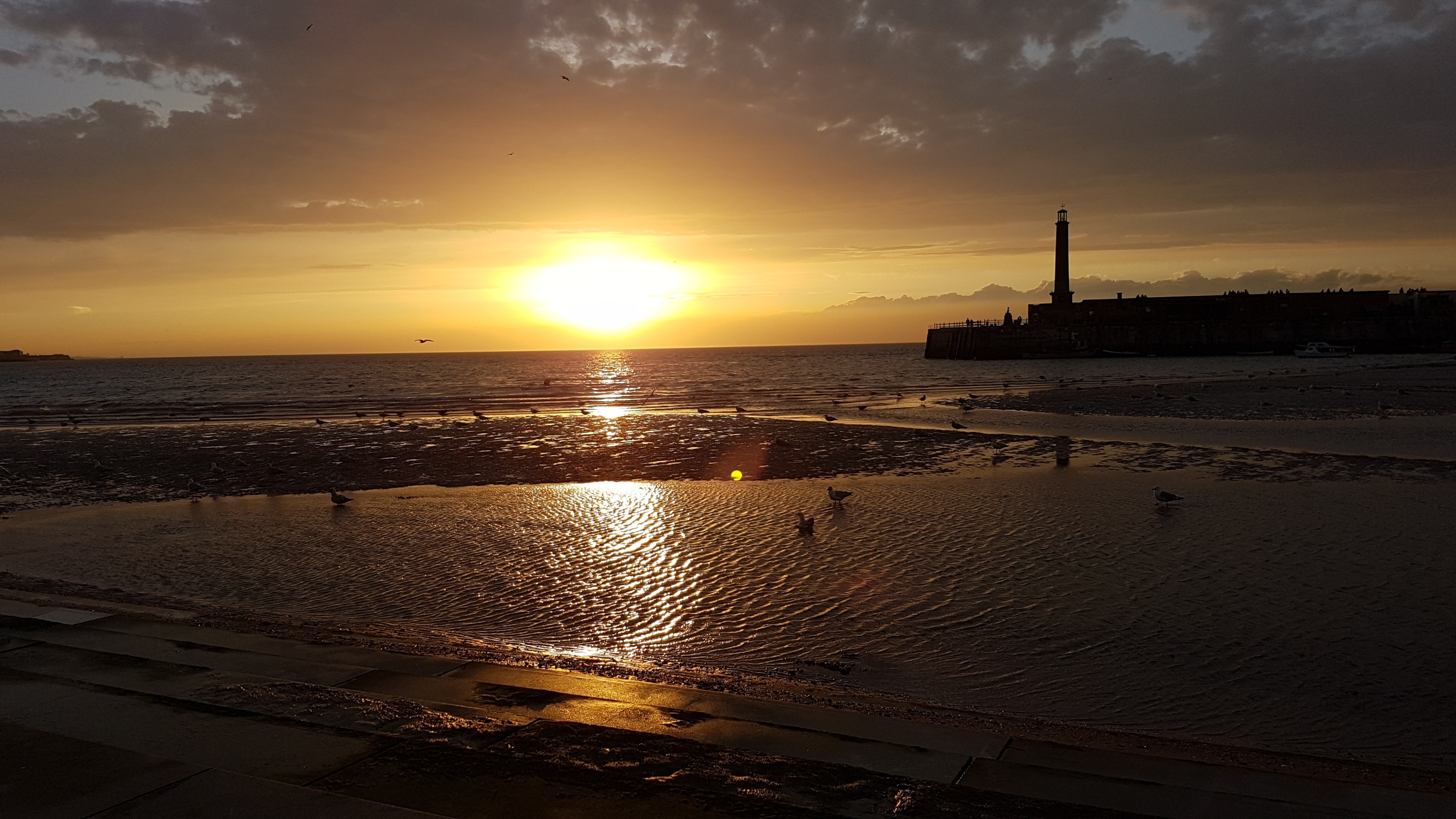 Sunset over Margate Harbour at low tide