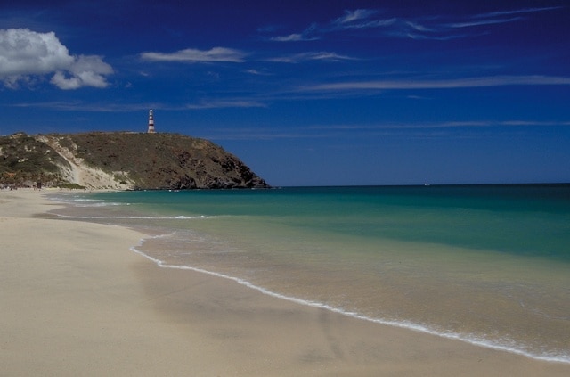 Puerto Cruz beach on the northeast end of the island looking towards the lighthouse on Punta Zaragoza.