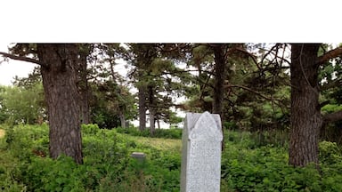 Century old pioneer Cemetary near Loon Lake. Urban legends tell of a witch's grave at this site. Those who trespass on it are said to be cursed for life.