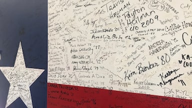 a lot of signatures on the wall