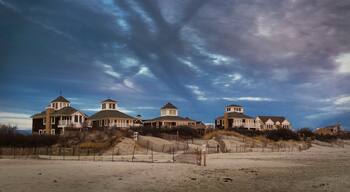 Went to Salty Brine State Beach and as the sun was setting, it cast a warm glow on these beach front homes. Overhead, a strange cloud pattern in the darkening winter skies.

#beach