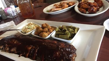 Hickory Ribs, honey BBQ and garlic Parmesan wings were to die for!!! The meat fell right off the bone! Sides were perfection as well! Highly recommend!  Staff were all amazing! And don't forget about the sweet tea! 