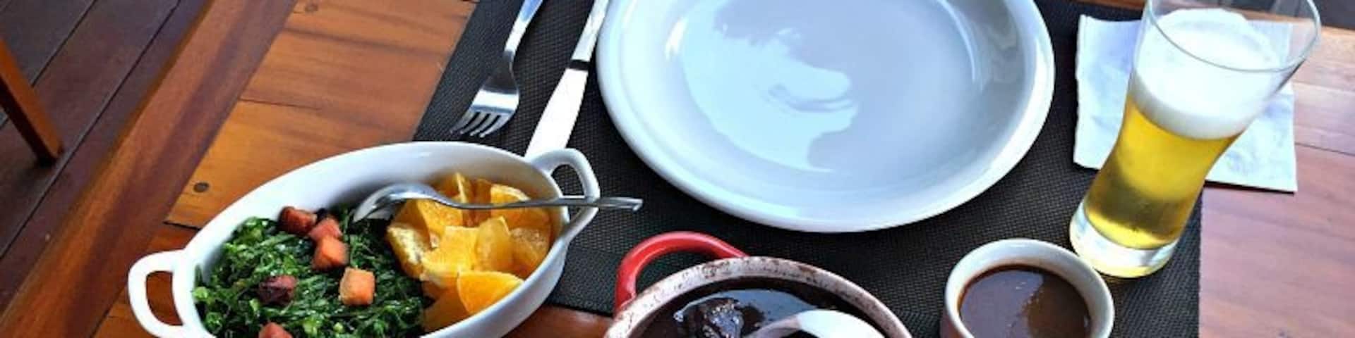 Feijoada is the national dish of Brazil, consisting of a meat and bean stew with rice, chicharrones, farofa and orange slices. Traditionally served on Saturdays, it's an all day affair and usually enjoyed by families in large groups. 
#delicious
http://www.badsentences.com/national-dish-of-brazil/