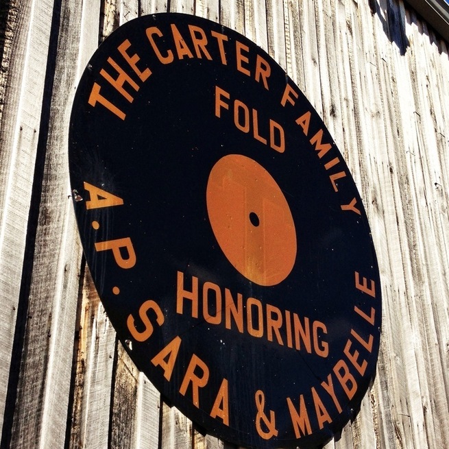 Janette Carter, one of three children of A.P. and Sara Carter established the Carter Family Fold to honor the memory of her parents and Maybelle Carter who played a historic role in helping give birth to the age of country music beginning in 1927. Even though Janette has passed away, her daughter Rita is carrying on the musical and performing legacy she established . The original Carter Family lived on this hallowed ground, right where the Carter Fold is today, in Poor Valley, at the foot of Clinch Mountain in southwest Virginia. This was their home and base of operations. Since 1974, the non-profit Carter Music Center has presented programs of old time and bluegrass music every weekend. Formally established in 1979, the Center's objective is to promote old-time music and pay tribute to the Original Carter Family (A.P Carter, Sara Carter, and Maybelle Carter). The Saturday concerts highlight the musical style made popular bythe Carter Family, considered by many as country music's first family. In keeping with the traditional music style, no electrical instruments are allowed (everything is acoustic). There's lots of dancing and fun for the entire family. Shows are family-oriented; no alcohol is permitted at concerts. Delicious home-fixed snacks are available at the Carter Fold Snack Bar, and you might be able to round out your collection of Carter Family recordings at the well-stocked souvenir and record concession. Come early and browse through our Museum before the show.
Once each year, a two-day (Friday and Saturday) festival takes place the first Saturday/Sunday weekend of August. Mountain craftsmen are on hand to sell their goods, and there's lots of good country cooking going on, too.
From the website: www.carterfamilyfold.org