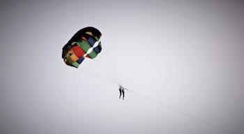 Parasailing silhouette at Miramar beach in Goa, India