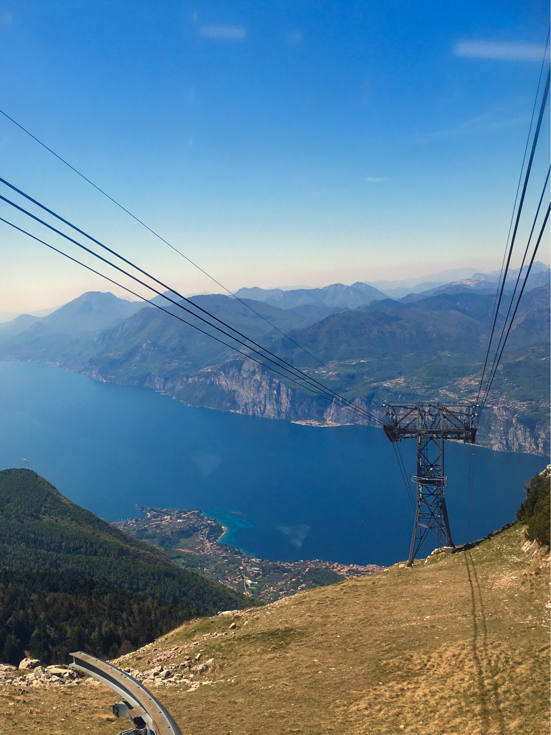 Going up on Monte Baldo with the Funivia Monte Baldo cable car, view over Lake Garda
