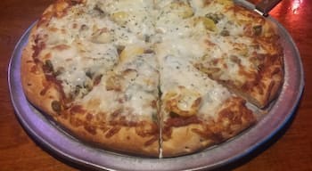 A pineapple, onion, banana pepper and green olive pizza from Wick's original location in The Highlands.