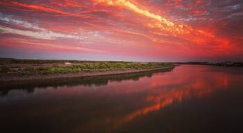 Sunset over the Pioneer River along the bike path.