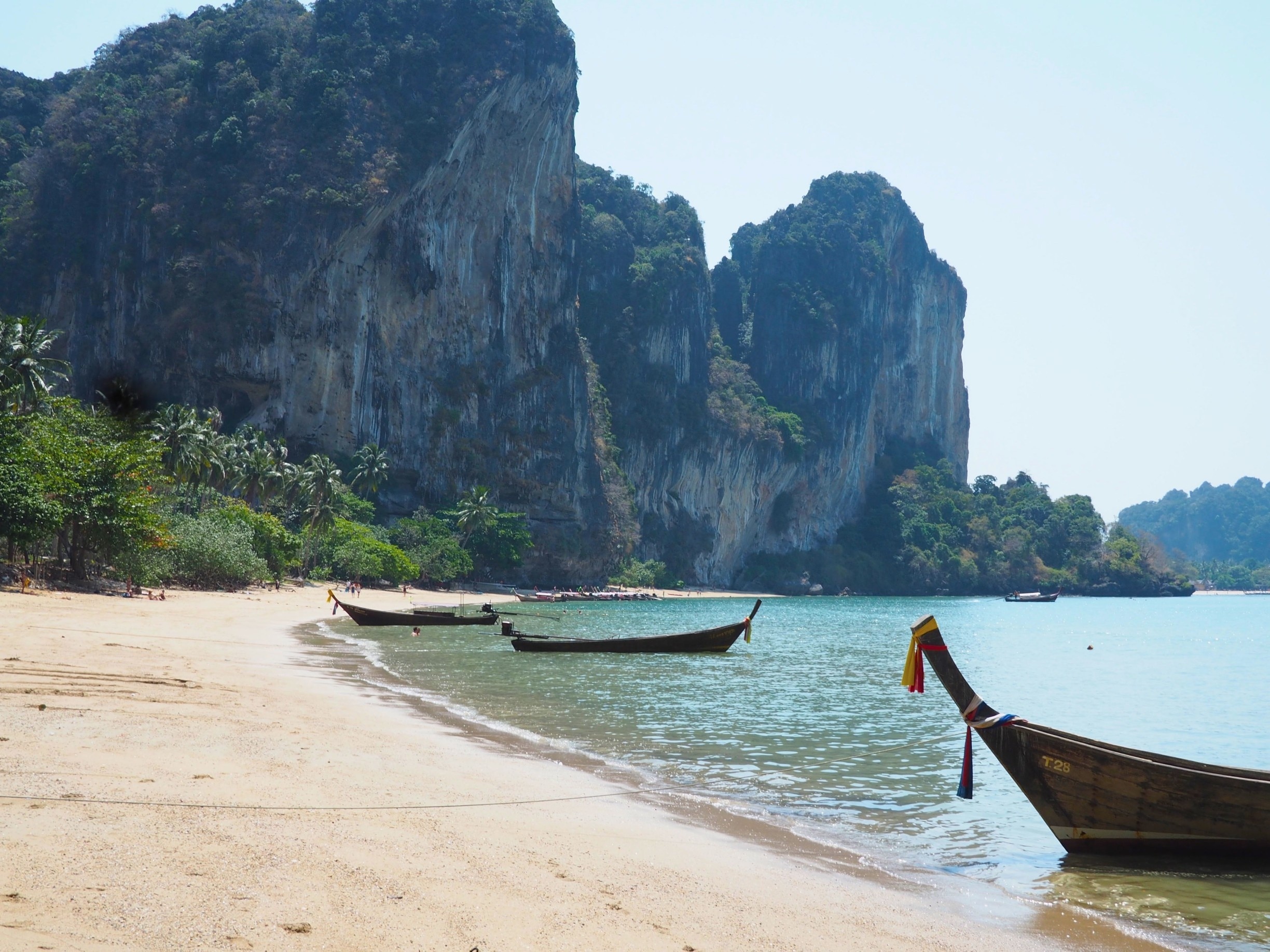 A 20 minute clamber up and over rocks (rope-assisted) from Railay West beach will take you to this gem. Quieter than the other beaches around Railay, and with coarser sand, it's nevertheless well worth making the effort. 

Read more at

http://www.aboveusonlyskies.com/reflections-on-railay/
