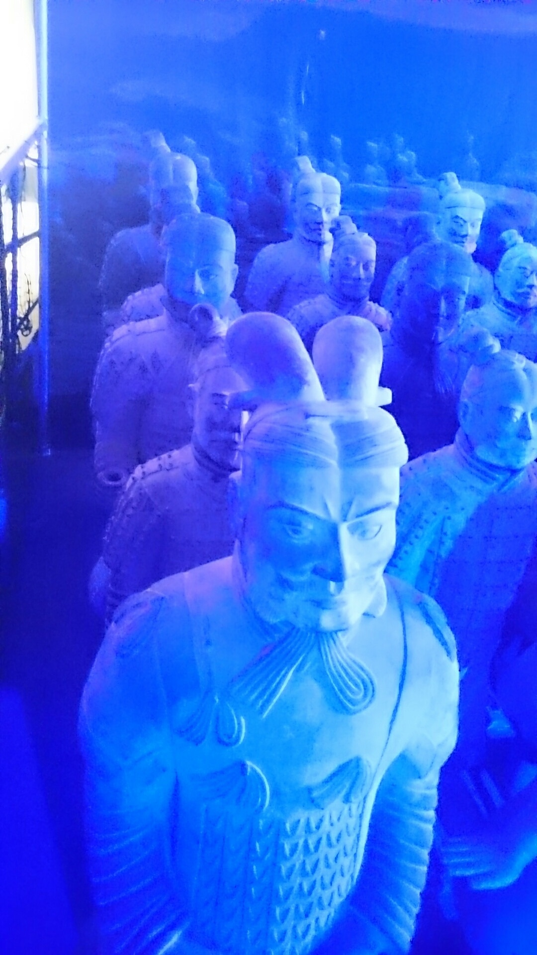 Terracotta Army Exhibition with life size replicas of the army highlighted with #blue light