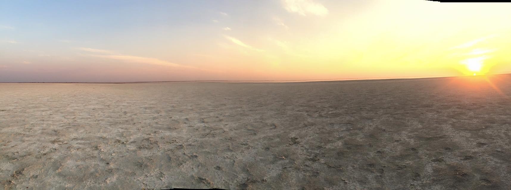 Sunset on the salt pans. Thousands of flamingoes on the horizon. Could mostly hear them rather than see them