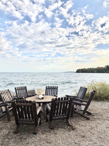 value: "Beautiful cool fall day to sit in this spot with a glass of Leelanau Cellars wine."
