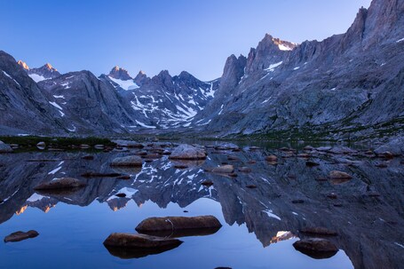 value: "My favorite backpacking trip of all time was to the wind rivers. I woke up before my companions to watch the sunrise on the surrounding peaks. The beauty was overwhelming.\n\n#adventure #hiking #backpacking #reflection #wilderness"
