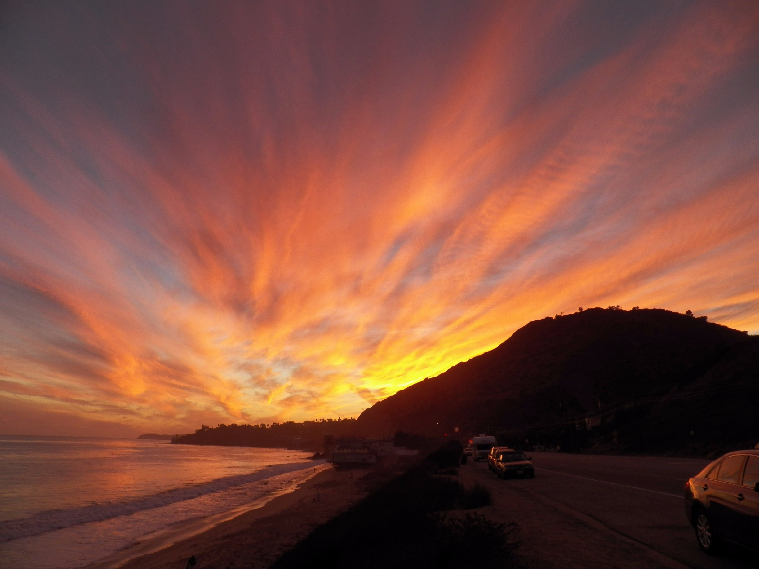 #GoldenHour at Corral Creek Beach in Malibu.
On this evening the sky was truly spectacular, the photo is unedited and doesn't have any filters, but standing there watching this was mesmerizing. 
It must be the way the Malibu coastline curves and the light hits it differently than other beaches along LA. For moments of serenity or romance head out to Malibu :) 