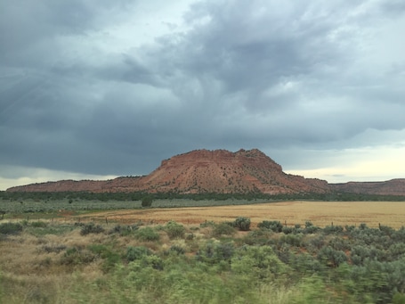 value: "The drive from Fredonia to Colorado City, AZ on hwy 389 provides scenery similar to this. The looming storm just added to the visual effects."
