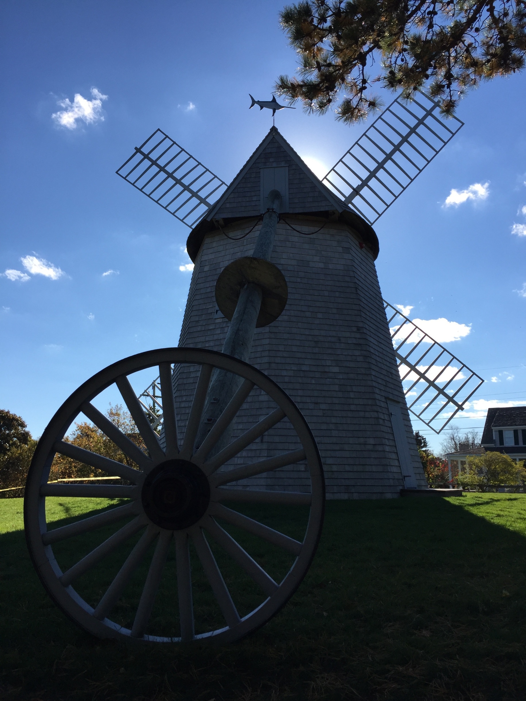 This windmill, The Godfrey Windmill, in Chase Park has none of its sheets mounted to the vanes.  The expression "three sheets to the wind" originated because a windmill with only three sheets deployed will not (operate) turn effectively.

There is a quiet area behind the windmill with a stone labyrinth.