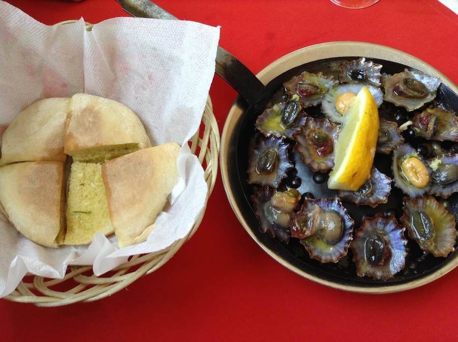 Two plates you can taste when you are visiting Madeira Island! “Lapas” and “bolo do caco” with garlic butter !!