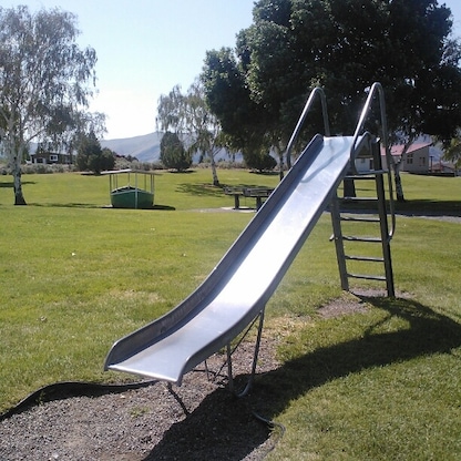 Always fun to find classic, "dangerous" playground toys still in existence. Kids today simply don't have enough chances to experience old school, high-velocity slides.