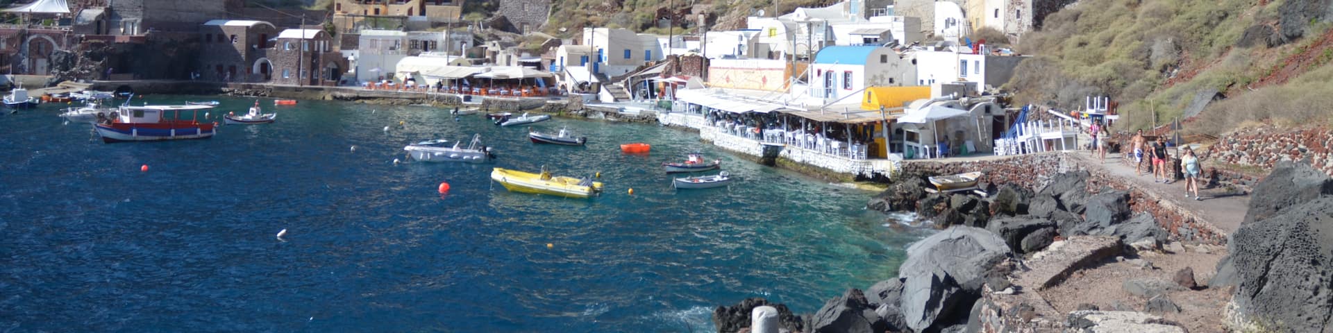 Amoudi Bay in Oia, Santorina.  It's literally a donkey track down many stairs to get to this little fishing port.  There are several lovely seafood restaurants down here.