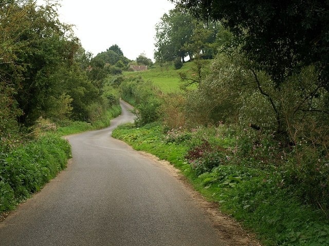 Scott's Way The lane into West Chinnock from the A356 at Bow Gate. Here it crosses the River Parrett at Bow Bridge before climbing Snails Hill and leaving the square.