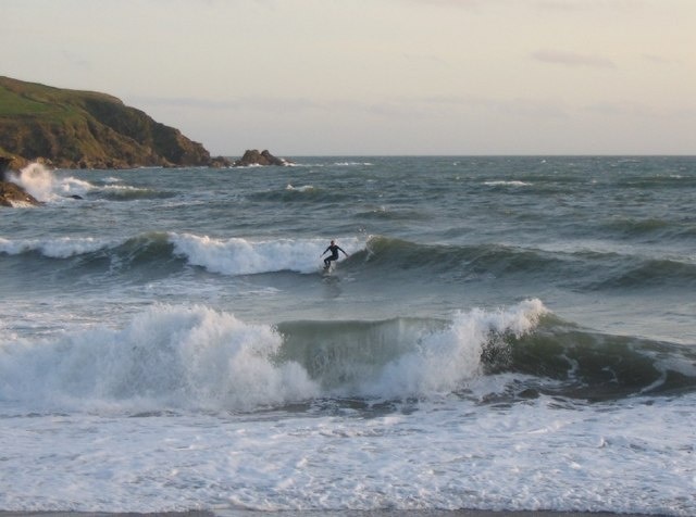 Surfing at Challaborough Bay A view looking south across Challaborough Bay.
