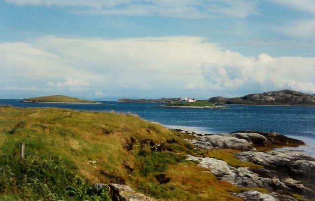 Loch Nam Madadh. A view looking northeast across Loch Nam Madadh, as the CalMac ferry from Uig makes its way past the islet of Fathoire on its way to Loch Nam Madadh pier.