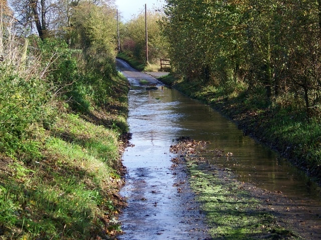 Flooded lane, Seend Cleeve After several hours of heavy rain during the morning this lane is partially flooded.