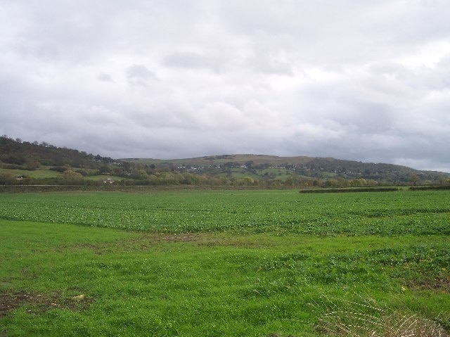 Gloucestershire & Warwickshire Railway Embankment. Looking south eastover the fields to the stretch of the railway between Bishop's Cleeve and Gotherington. In the distance is Cleeve Hill.