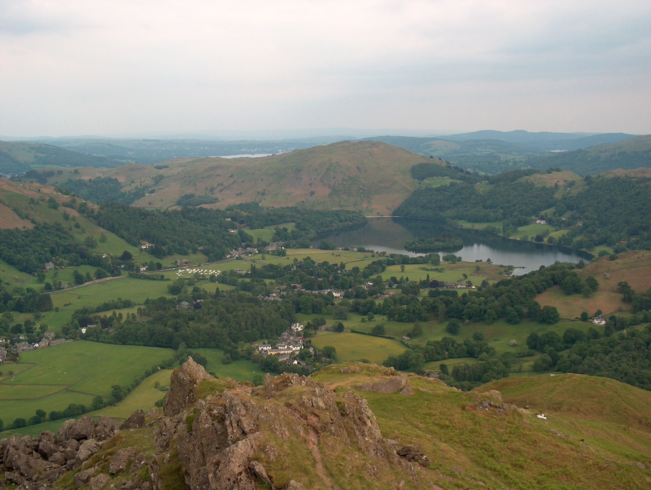 The top of Helm Crag The iconic hill which towers over Grasmere. Here you can see over Grasmere to Loughrigg.