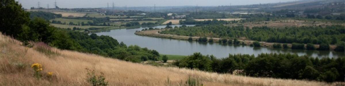 Photo "Treeton Dyke The small lake Treeton Dyke on the South East corner of Sheffield / Rotherham, originally the old course of the River Rother. Surrounded by woods, rivers and fields this was a wonderful place for a country loving kid to grow up!" by Andy Gibson (Creative Commons Attribution-Share Alike 2.0) / Cropped from original