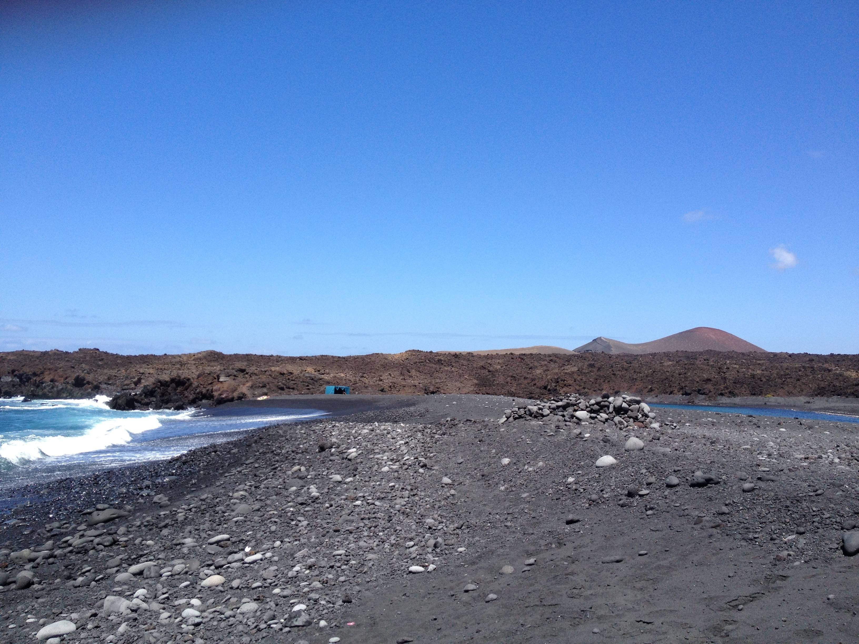 Black sand beach at the bottom of the old Montaña Bermeja volcano