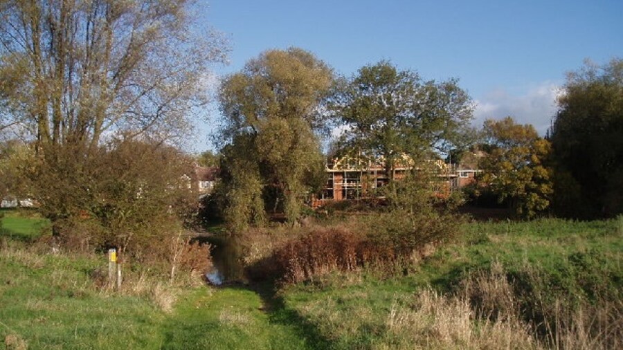 Photo "Ford. Ford of the river Great Ouse as it passes Clapham, looking across towards a new house being built on the far (Clapham) side. The ford itself doesn't look particularly suitable for normal cars ;-) (it's only a bridleway and farm track on the photographer's side)" by Oliver White (Creative Commons Attribution-Share Alike 2.0) / Cropped from original
