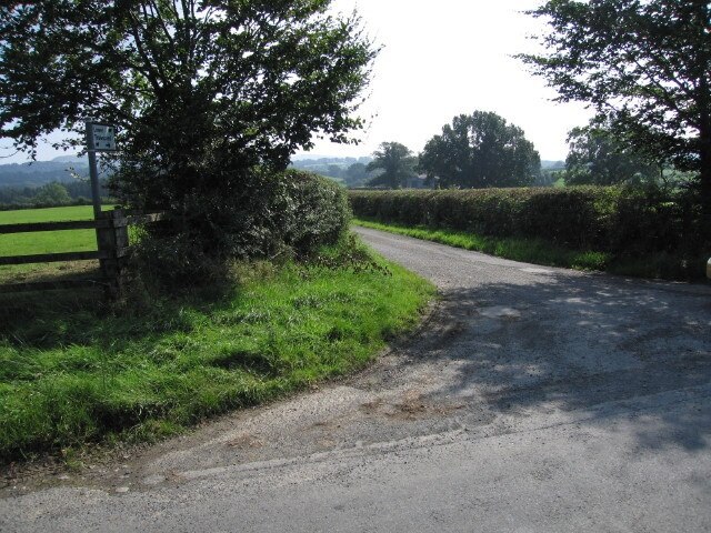 To the farm Junction with a dead end lane that runs roughly alongside the eastern side of the square.