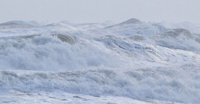 Waves in Carnoustie Bay. A detail of the waves in 1143991. The Waves are moving in a northwesterly direction. Breaking along the main sea defences 308075.